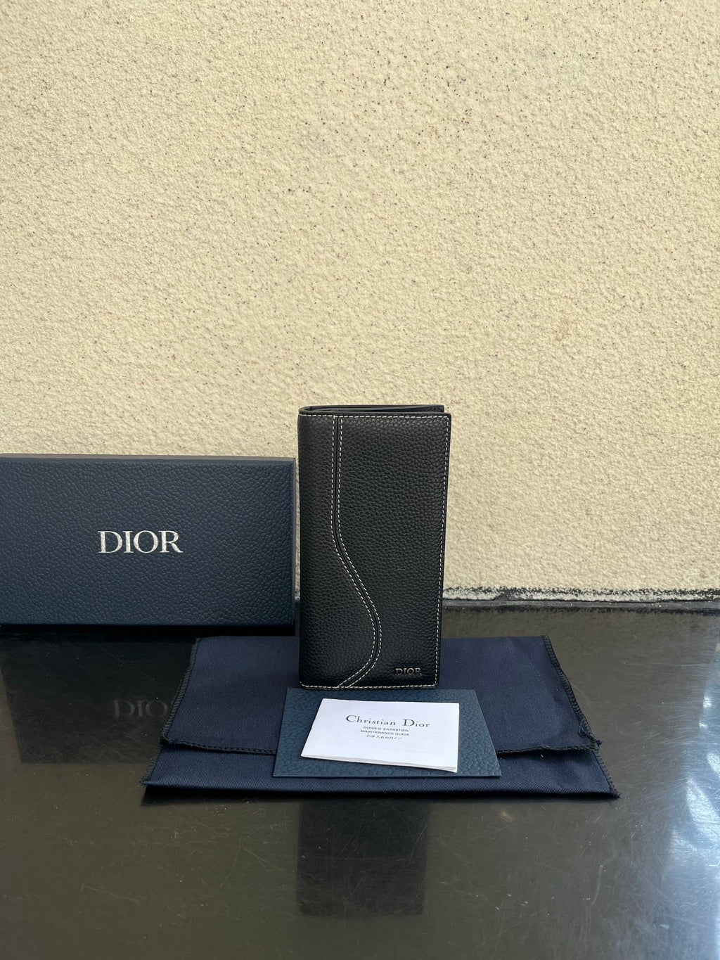 Small bag in dark gray textured leather with top card-slot opening and Dior logo