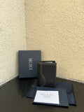 Small bag set with dark leather-style wallet and Dior box, papers