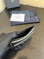 Dior card holder interior view with card slots, textured dark leather and trim