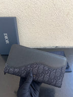Small Dior bag in dark textured leather with monogram canvas panel and zipper