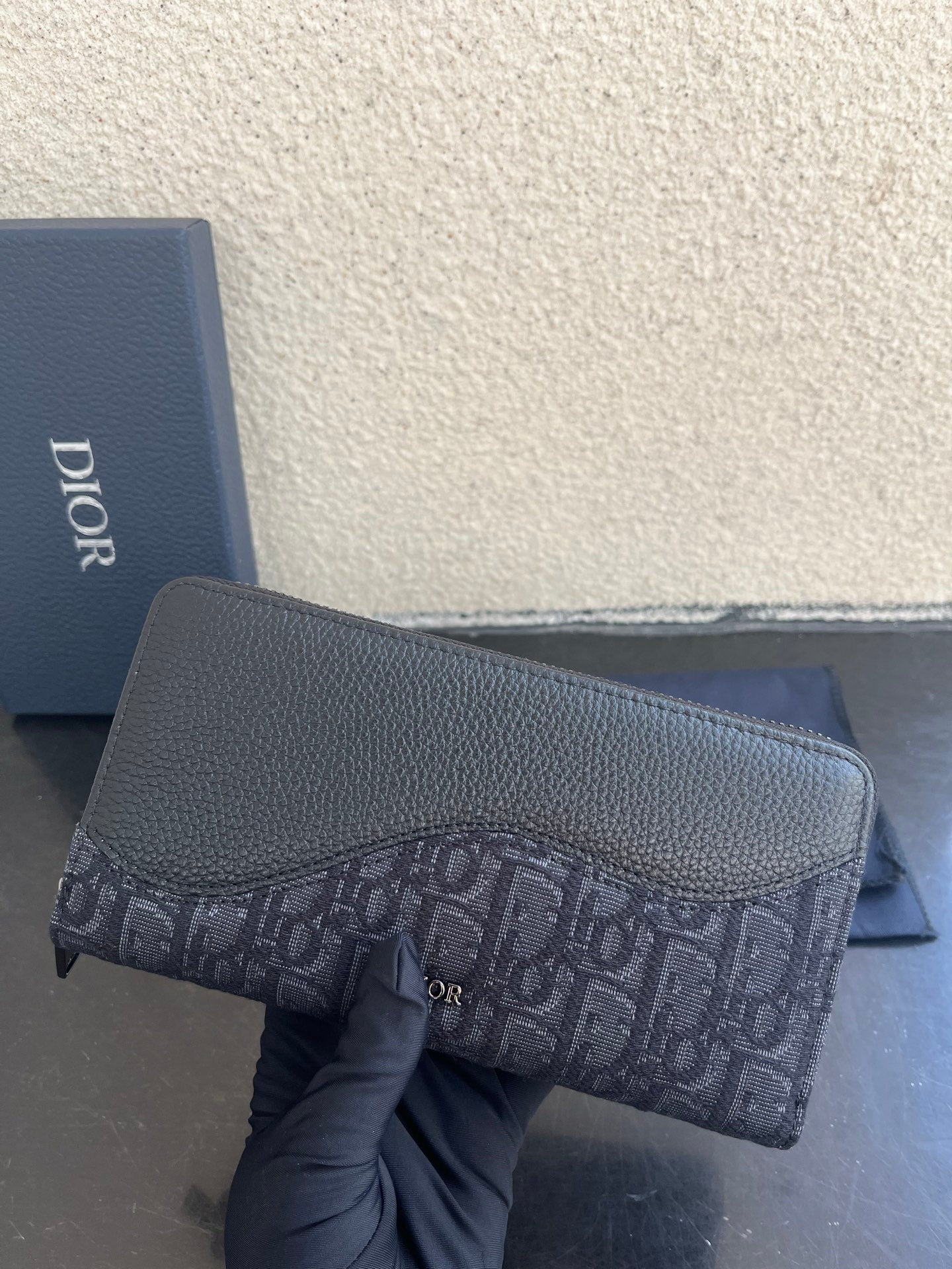 Small Dior bag in dark textured leather with monogram canvas panel and zipper