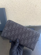 Small Dior monogram canvas bag with top zipper and textured strap ends