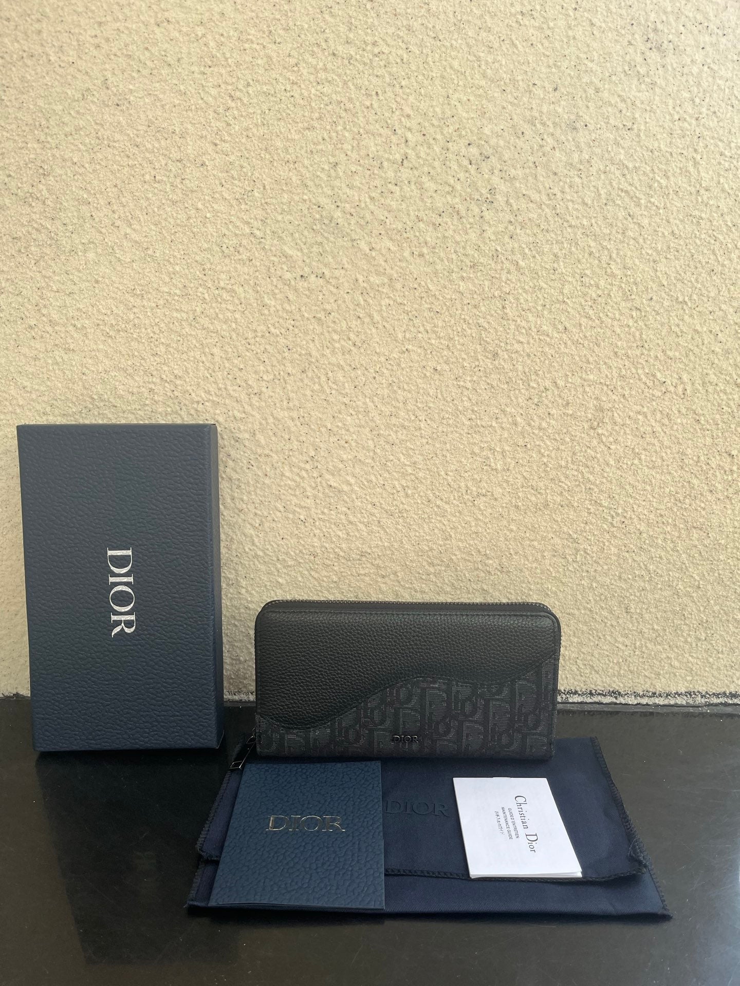 Small Dior bag with monogram canvas front flap and top zipper closure