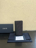 Small bag card holder in dark textured leather with Dior logo, front view