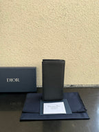 Small bag card holder in dark leather with logo patch and price card