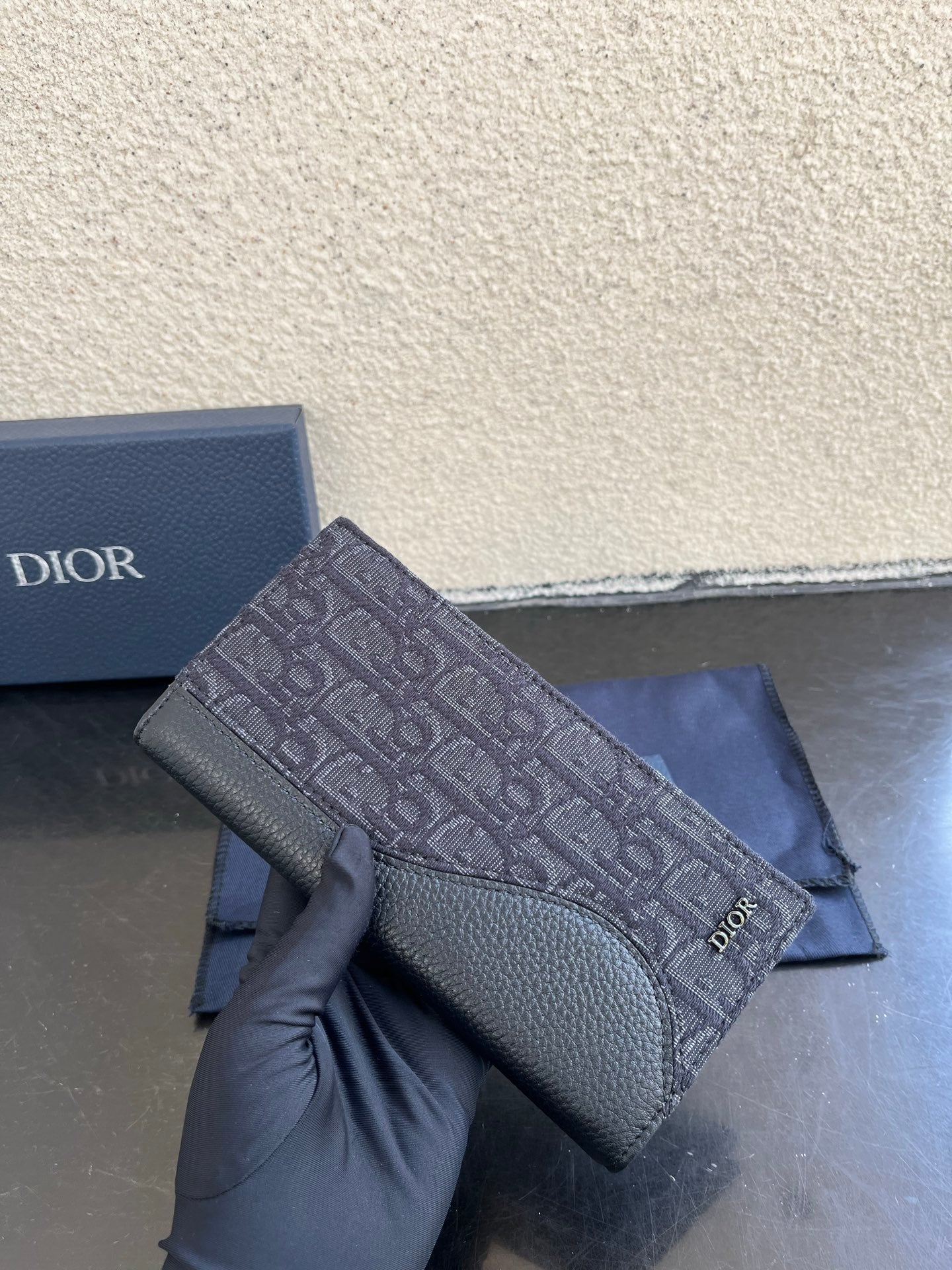 Small bag card holder close-up of Dior monogram exterior and leather flap