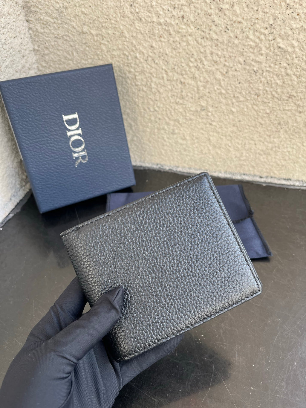 Dior small bag wallet in textured dark leather with front flap