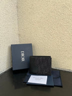 Dior small bag wallet in dark monogram canvas with snap closure