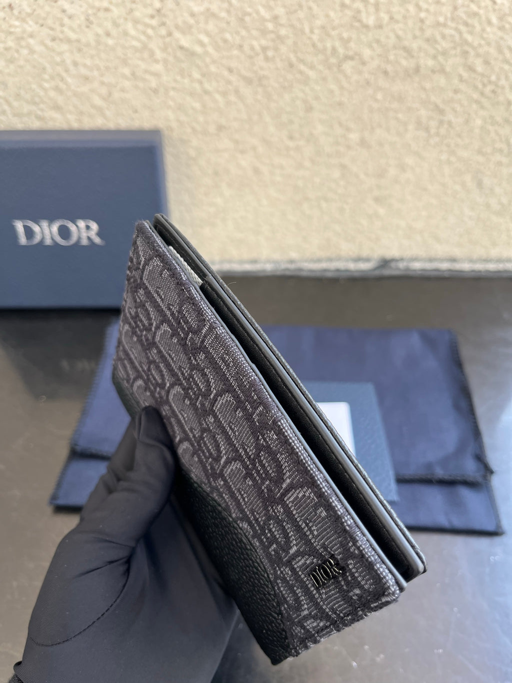 Dior small bag with gray monogram canvas and top zipper opening