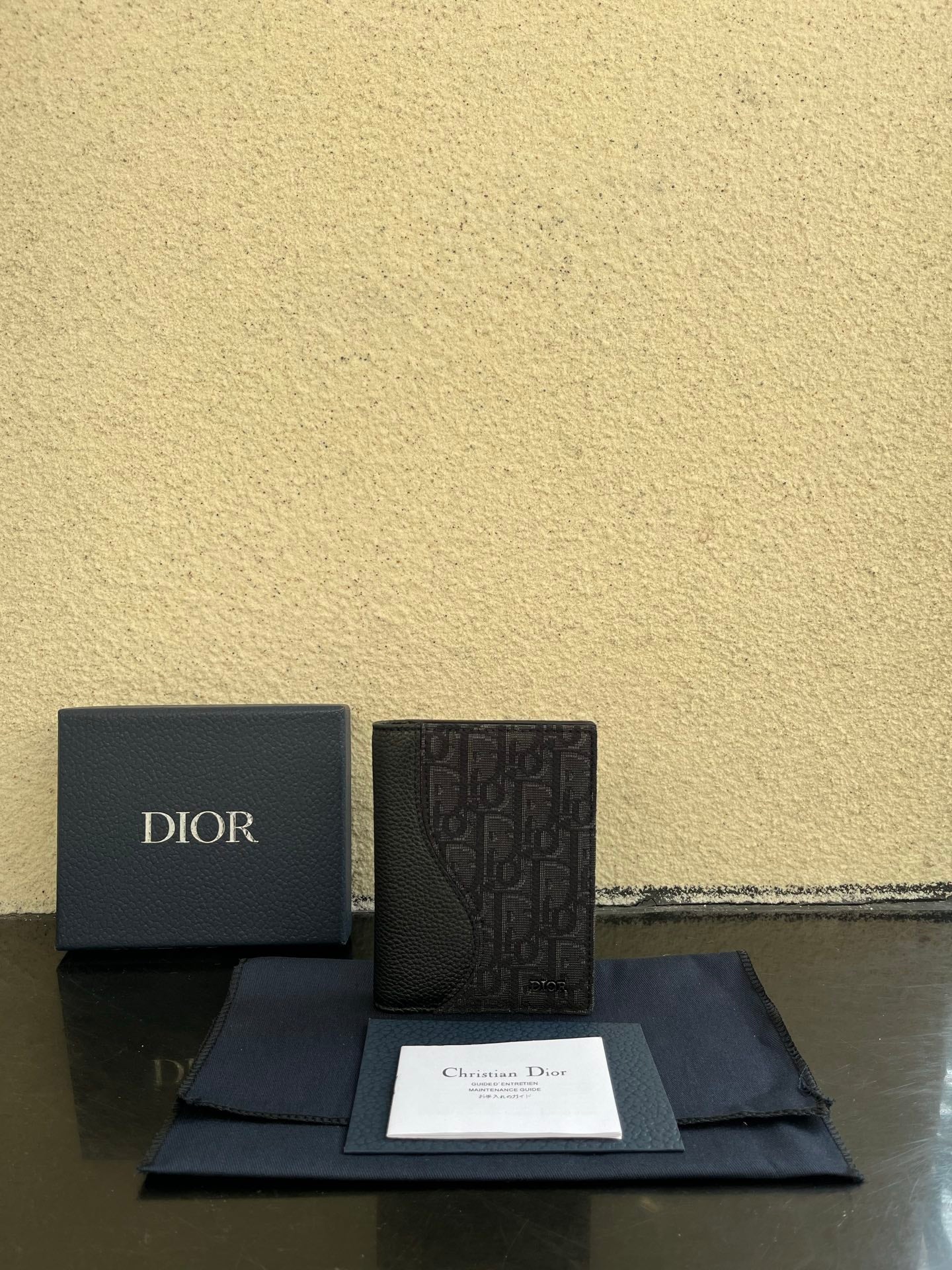 Dior small bag in dark grained leather with monogram front panel