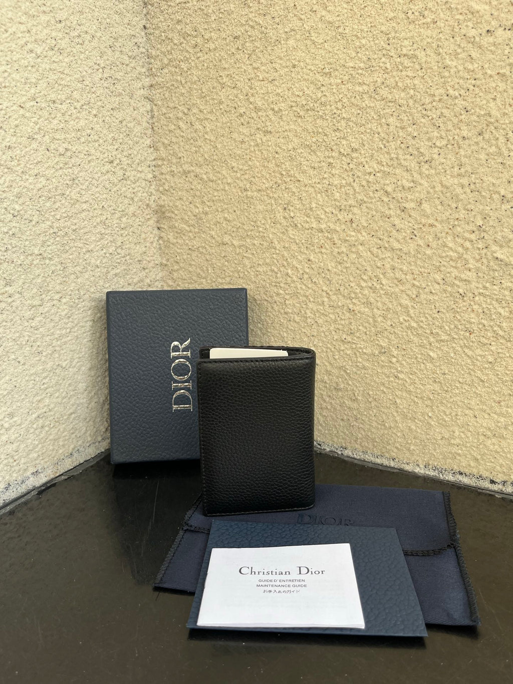 Dior small bag with dark leather and embossed panel, with matching box and documents