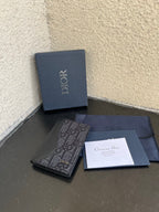 Dior small bag with stamped dark leather and blue box, plus gift documents