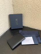 Dior small bag with smooth dark wallet design, with papers and matching box