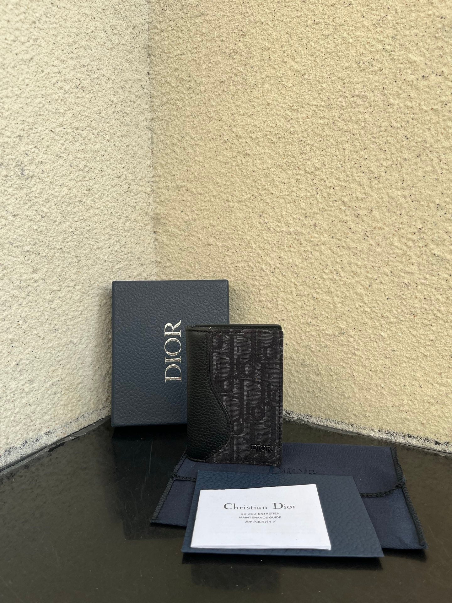 Dior small bag set with textured dark leather and embossed logo, plus box and papers