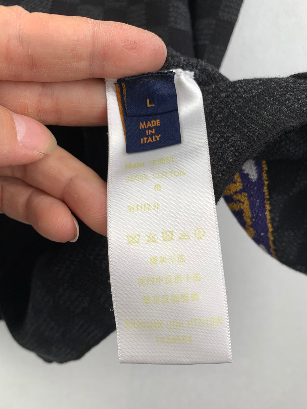 Louis Vuitton shorts care label with Made in Italy on white tag