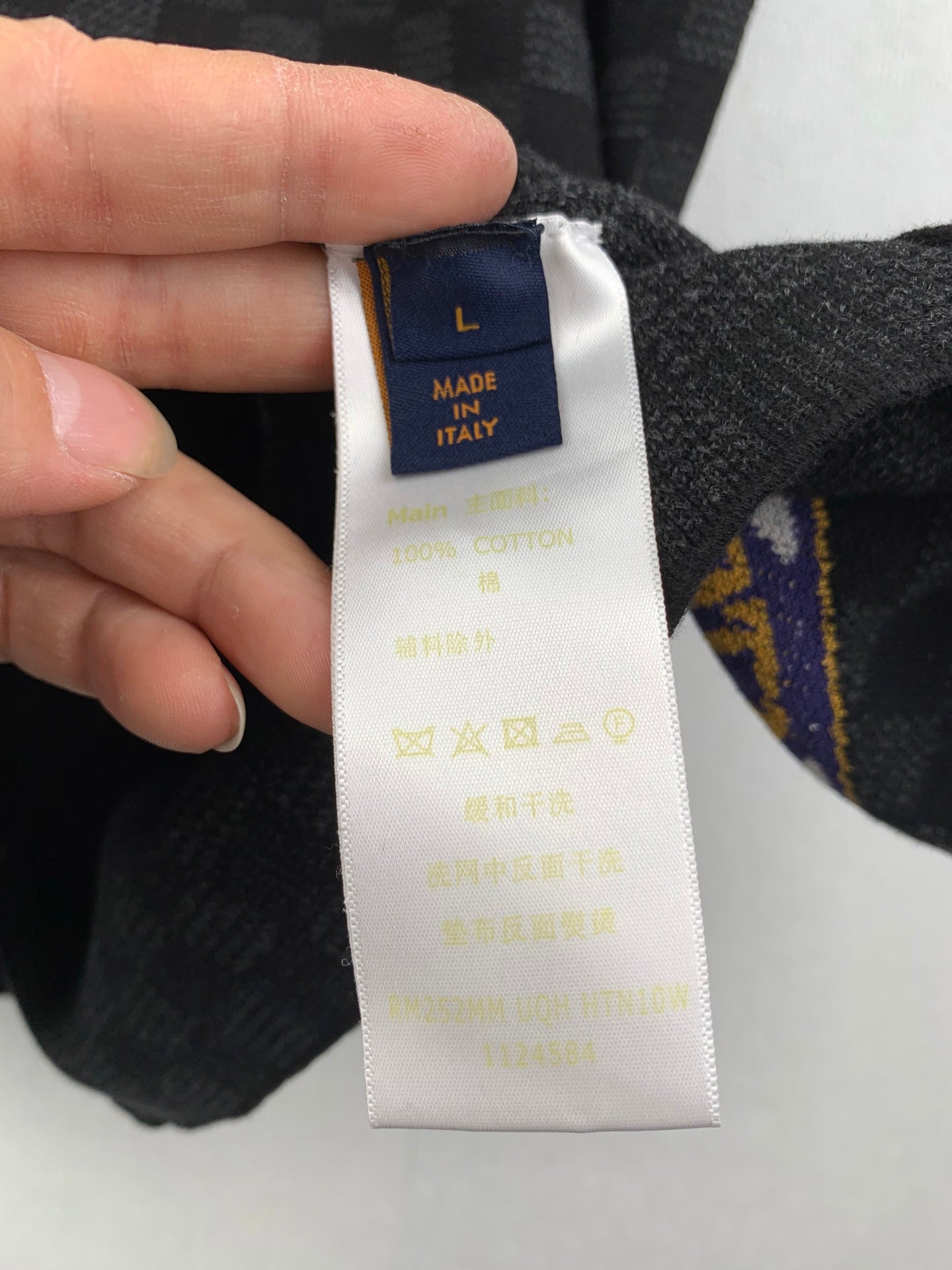 Louis Vuitton shorts care label with Made in Italy on white tag