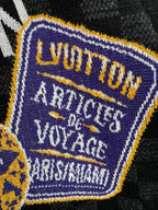 Black check short-sleeve T-shirt close-up of embroidered square patch detail