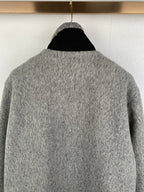 Gray long-sleeve jacket with stand collar; plain rear view
