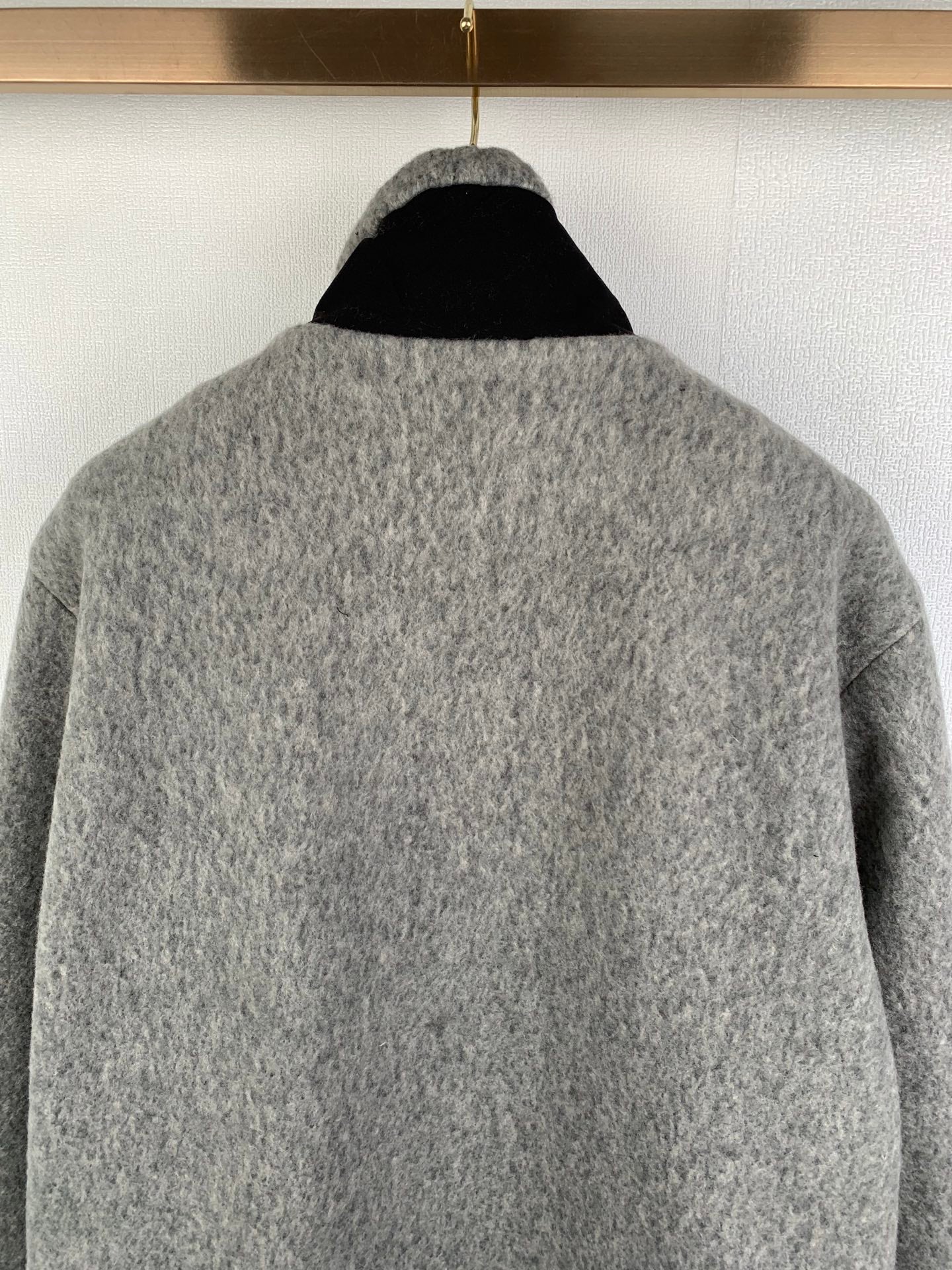 Gray long-sleeve jacket with stand collar; plain rear view