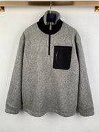 Gray long-sleeve zip jacket with black collar and chest pocket