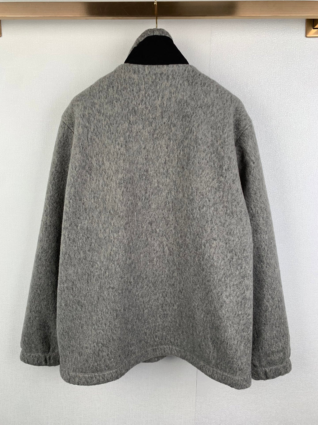 Gray long-sleeve jacket with stand collar; plain back view