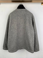 Gray long-sleeve jacket with stand collar; plain back view