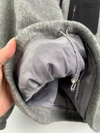 Gray jacket with black inner collar and drawstring pouch detail