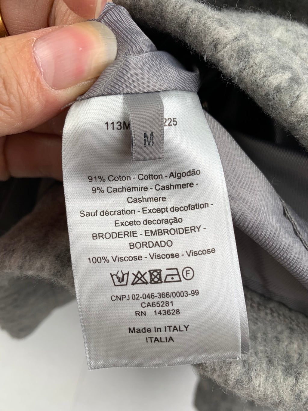 Gray long garment fabric label with size and care details