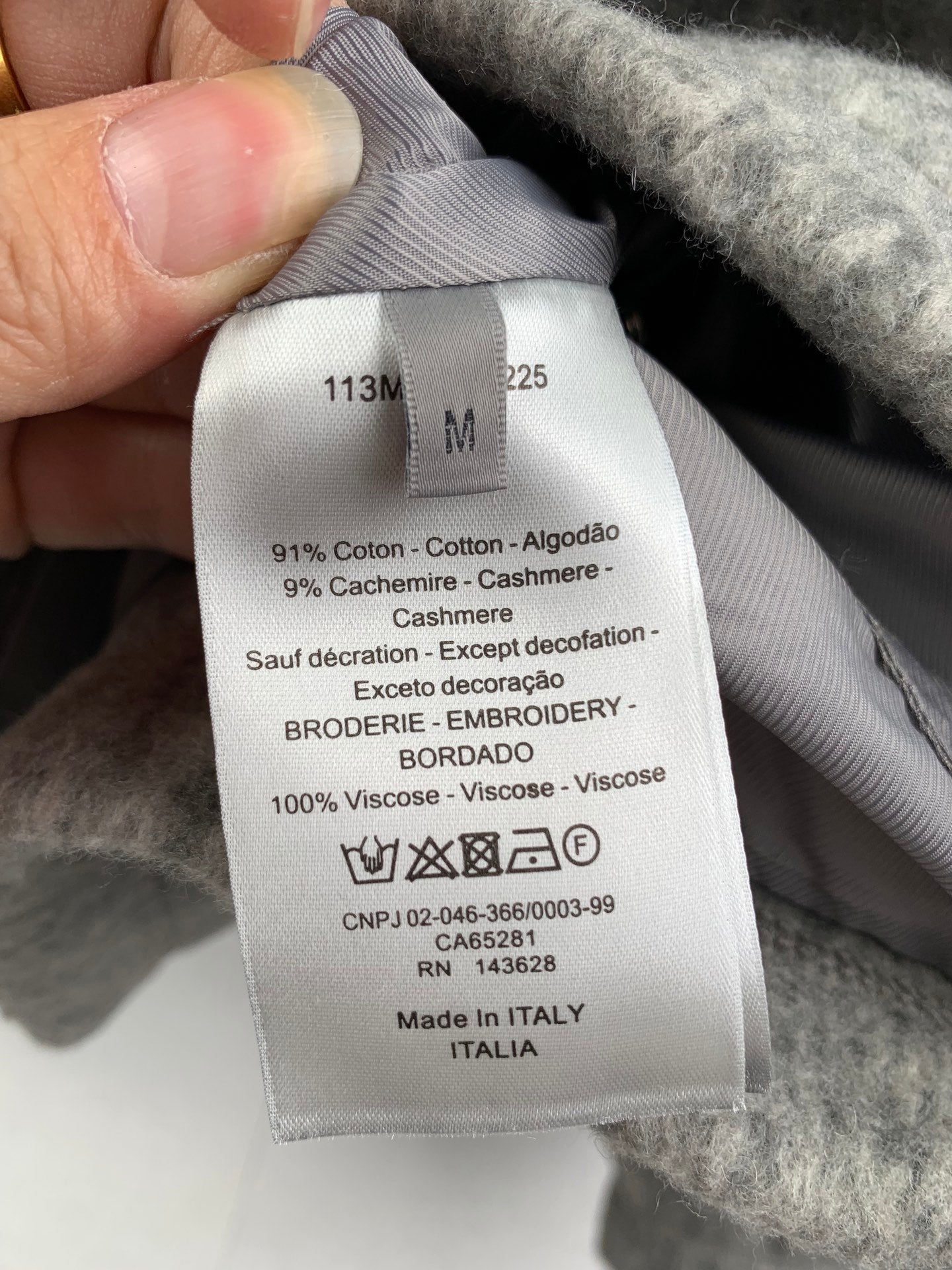Gray long garment fabric label with size and care details