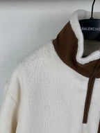 Cream fleece quarter-zip jacket with brown stand collar and zip front
