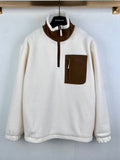 Cream fleece quarter-zip jacket with brown contrast collar and chest pocket