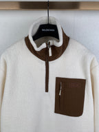 Cream fleece quarter-zip jacket with Balenciaga neck label and Dior chest patch pocket