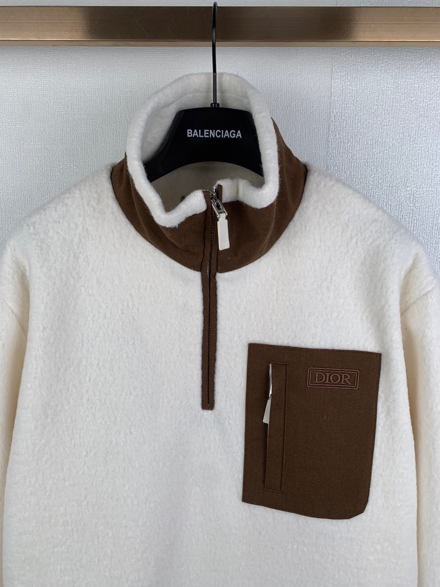 Cream fleece quarter-zip jacket with Balenciaga neck label and Dior chest patch pocket
