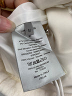 White fabric top with size M and care label