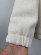 Cream fleece jacket sleeve with ribbed cuff detail