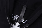 Dark hoodie neckline with inner label patch and zipper tape