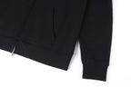 Dark hoodie with long sleeves, cuffs, and hem near the front zipper placket