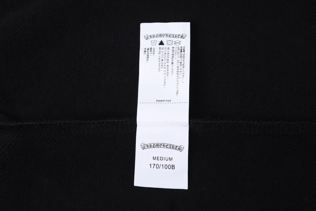 Dark hoodie with white size and care label on inner back neck