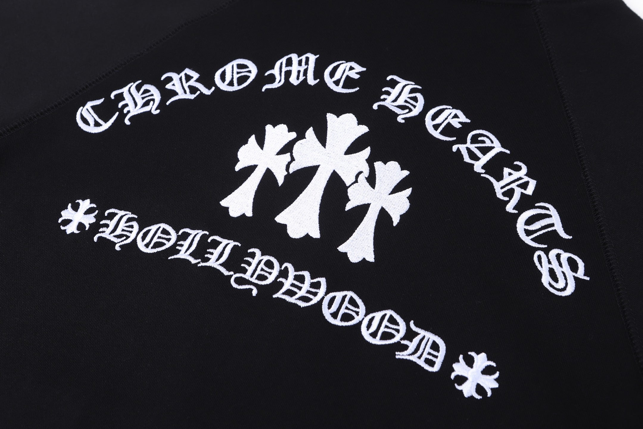 Dark hoodie with large white abstract graphic print on the back