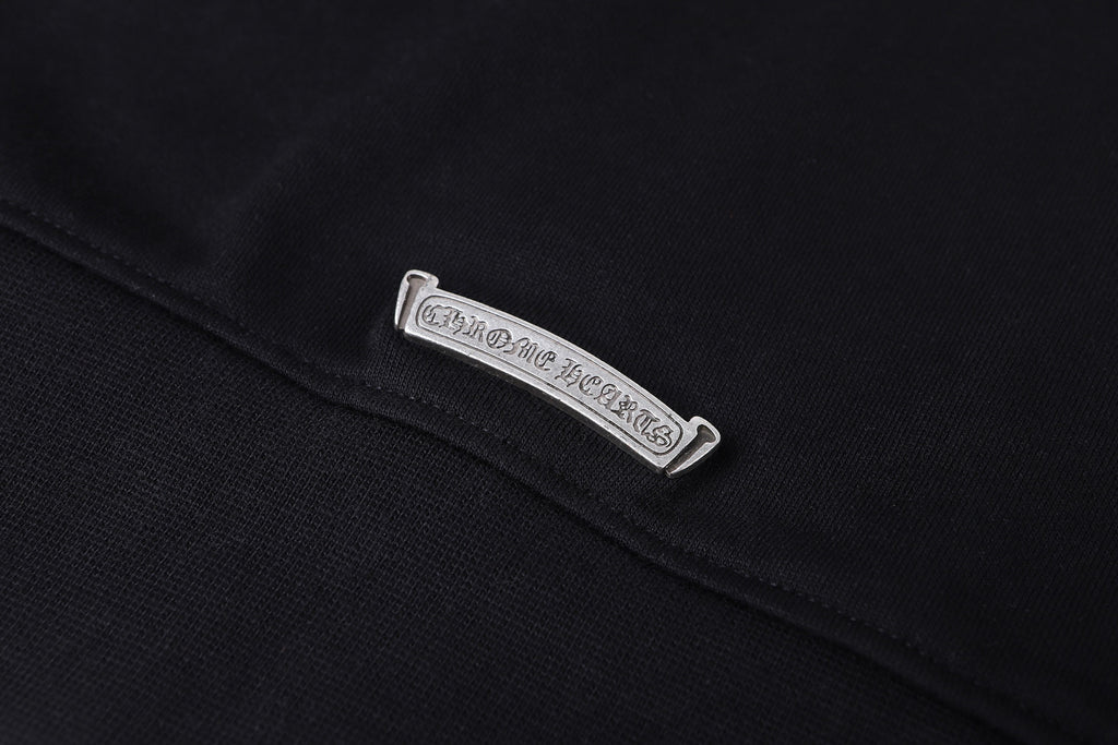 Dark hoodie with rectangular care label on the collar seam