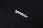 Dark hoodie with rectangular care label on the collar seam
