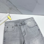 Versace light-gray denim jeans close-up of front waist with belt loops and button