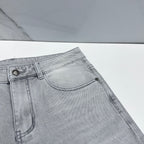 Versace denim jeans close-up of front fly and coin pocket with metal button