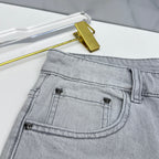 Versace denim jeans close-up of front coin pocket with small stitched logos