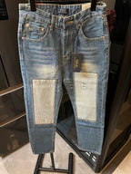 Light-wash denim jeans with front and back patch pockets, button fly