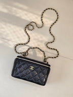 Chanel quilted mini bag, dark navy, with gold chain strap and front CC logo