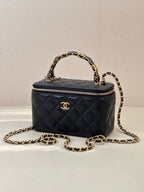Chanel quilted mini top-handle bag in dark navy with gold chain strap