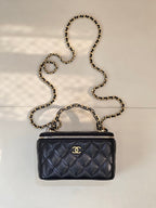 Chanel quilted mini bag in dark navy with gold chain strap and zipper top