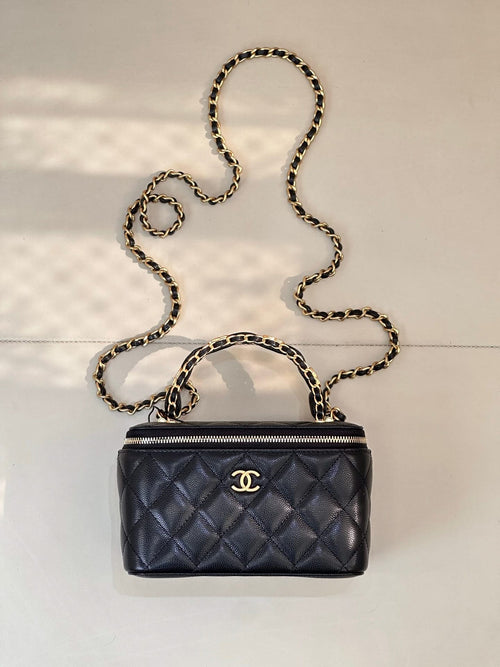 Chanel quilted mini bag in dark navy with gold chain strap and zipper top