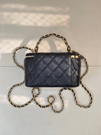 Chanel quilted mini bag in dark navy with gold chain shoulder strap